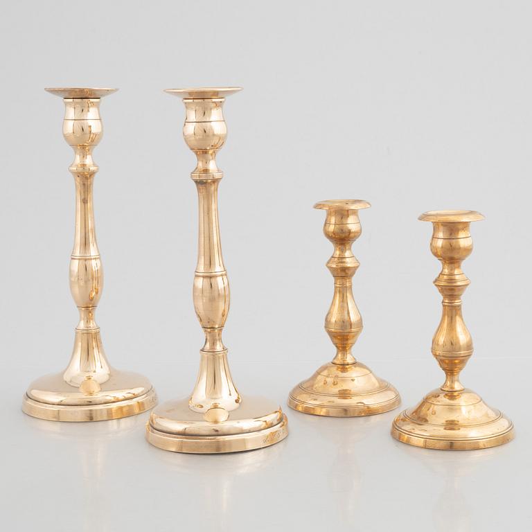 Skultuna Messinsbruk, two pairs of brass candlesticks, 19th century.