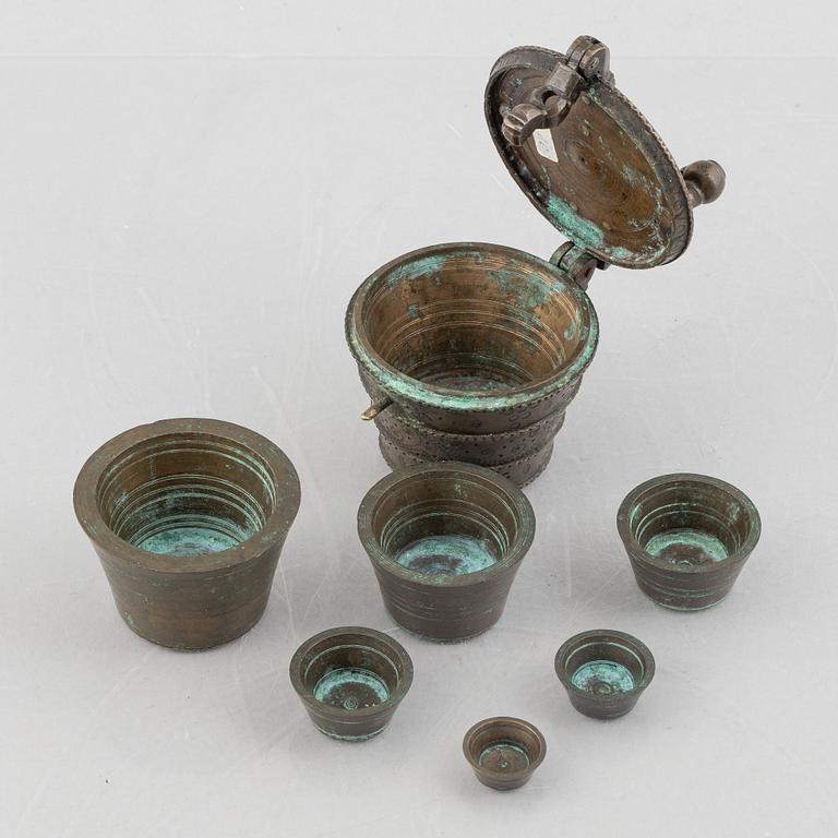 A set of three Nuremberg brass nested cup weights, one by Christoph or Johan Conrad Schön (masters 1746(1750).