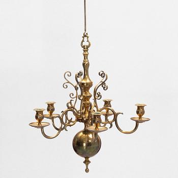 A brass chandelier, no 205, Skultuna Bruk, Sweden.