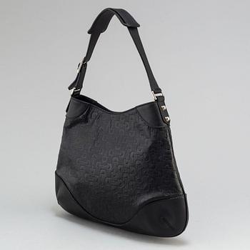 GUCCI, a black leather handbag.