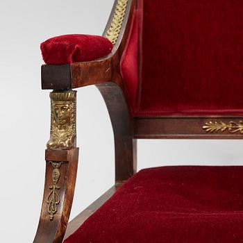 A pair of Empire style armchairs, first half of the 20th century.