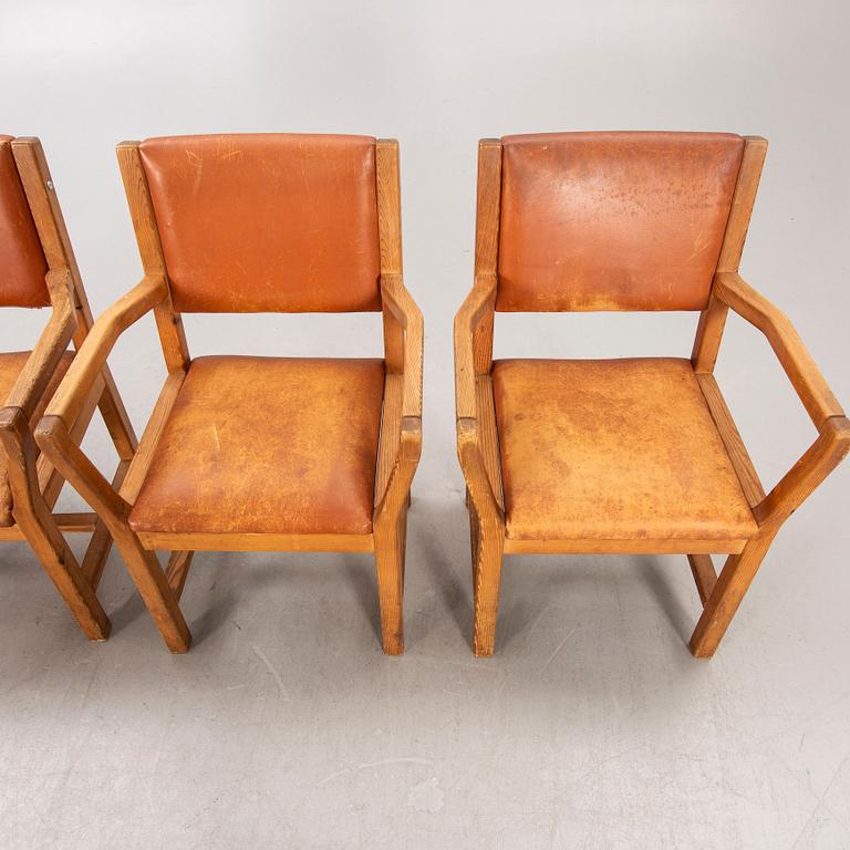 A set of four 1970:s Tage Poulsen Daumiller oak and leather armchairs for GM Möbler Denmark.