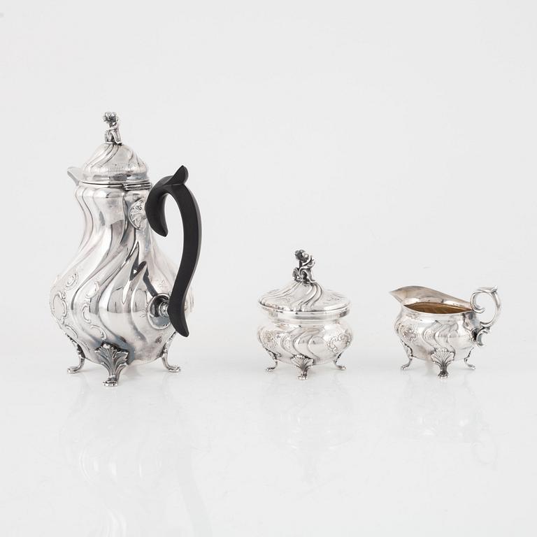 A Swedish Rococo Style Silver Coffee Pot, Creamer and Sugar Bowl, mark of GAB /CG Hallberg, Stockholm 1959-62.