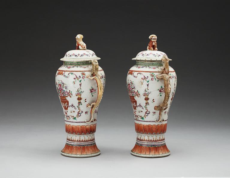 A pair of famille rose vases with covers, Qing dynasty, Qianlong (1736-95).