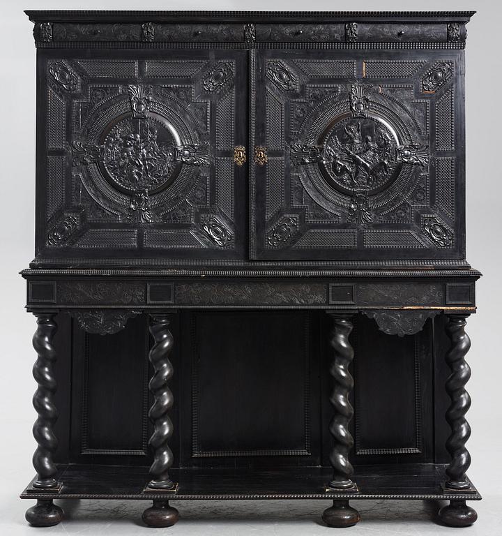 A Louis XIV and Louis XIV-style carved ebony, ivory and tortoiseshell-inlaid cabinet on stand, 17th and 19th century.