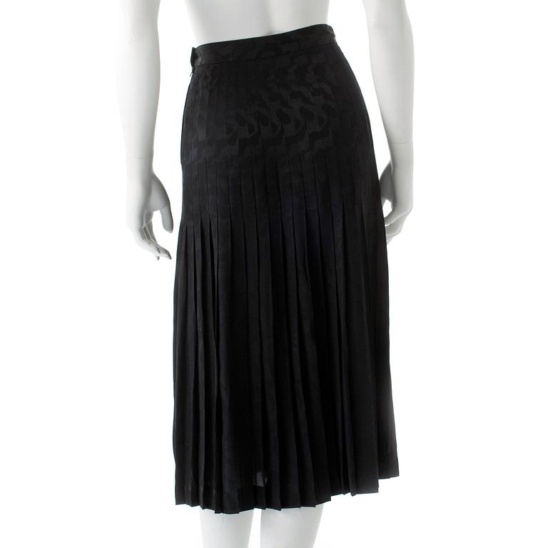 VALENTINO, a black silk skirt.