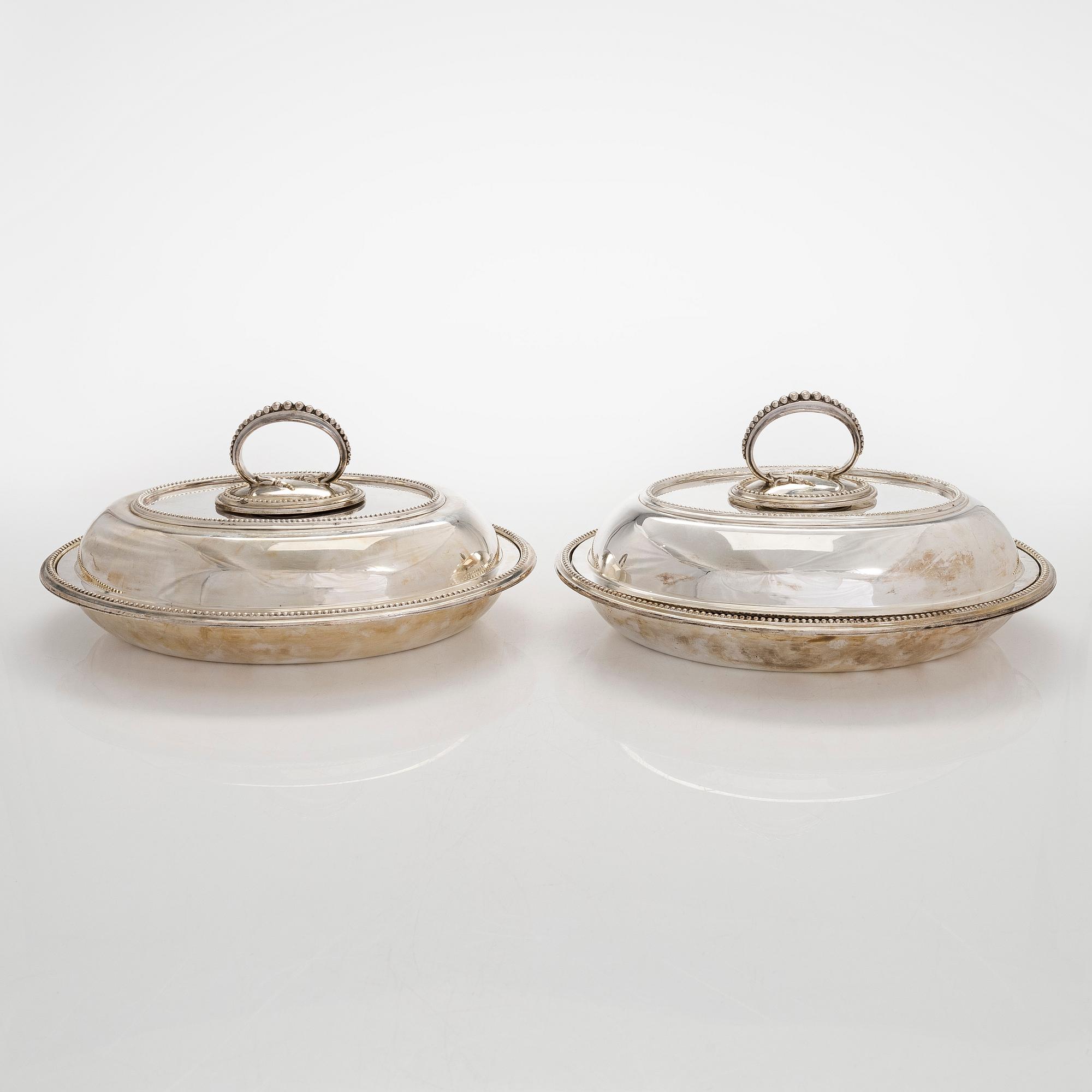 A set of four silver plated entree dishes, England.
