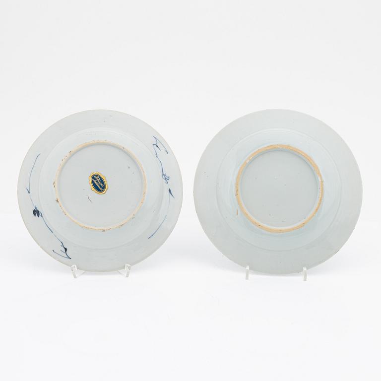 A blue and white serving dish and eight odd plates, Qing dynasty, 18th Century.