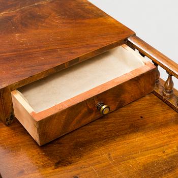 A  mahogany empire dressing 19th century table with mirror.