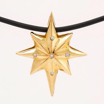 Hänge på latex, 18K med briljanter ca 0,03 ct, längd ca 40 cm, hänge ej avtagbart.