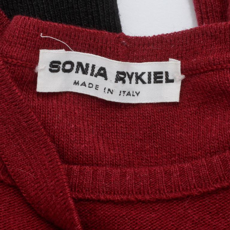 SONIA RYKIEL, a burgundy red wool sweater.