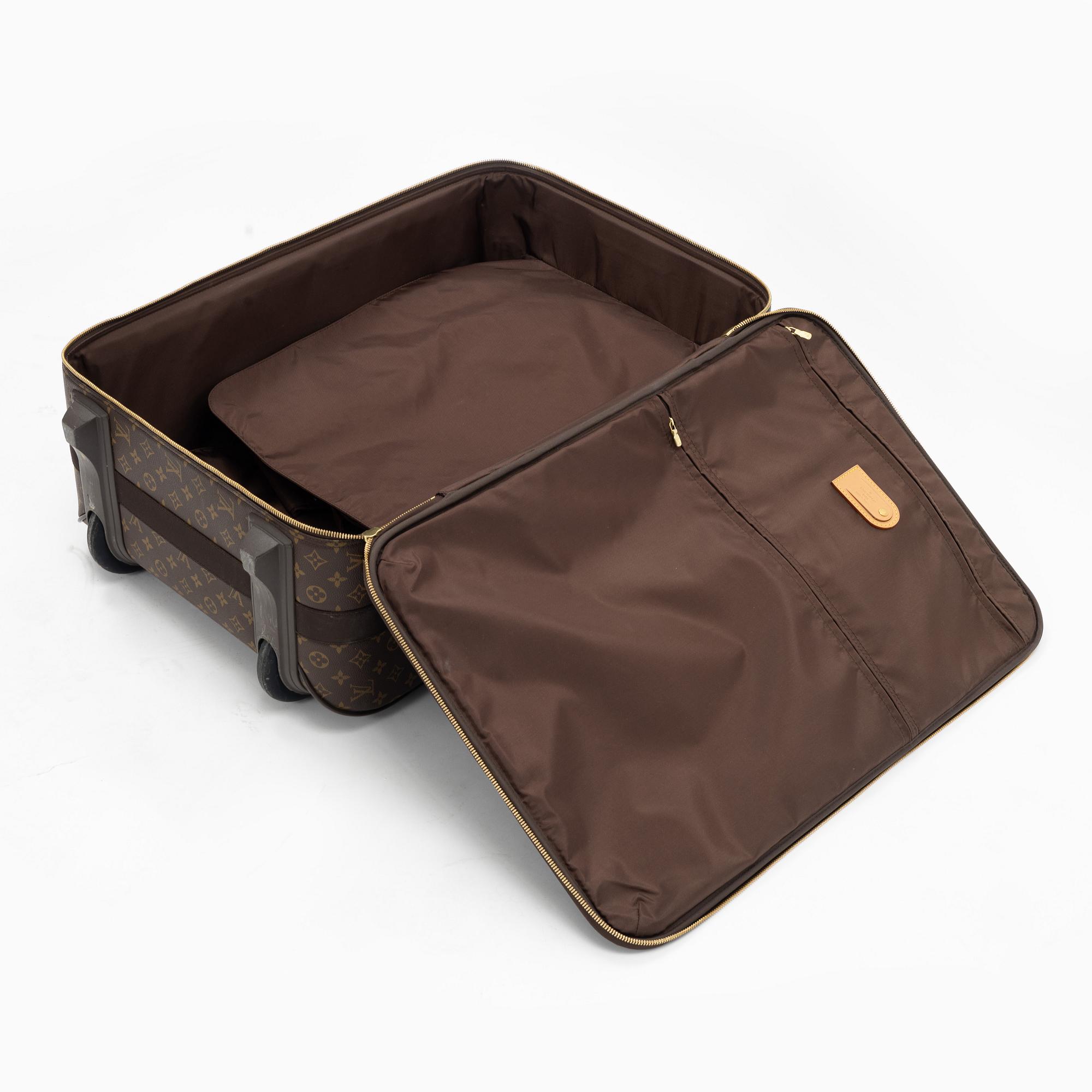 Louis Vuitton, a monogram canvas 'Pégase 65' suitcase.