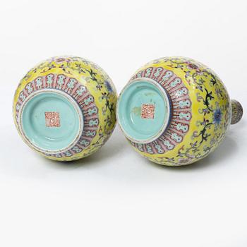 A pair of Chinese yellow ground porcelain vases, 1900s.