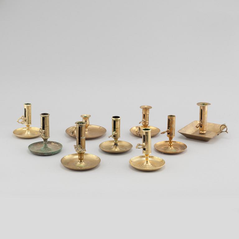 Nine brass candlesticks, 20th century.