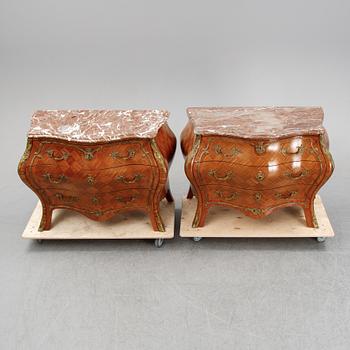 A pair of rococo style chest of drawers, mid 20th Century.