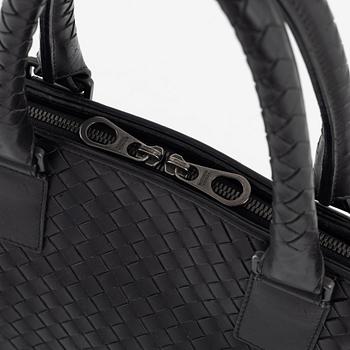 Bottega Veneta, a black leather briefcase.