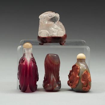 597. A group of three snuff bottles and a rock chrystal figure, 20th century.