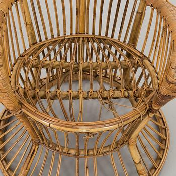 A RATTAN ARMCHAIR.