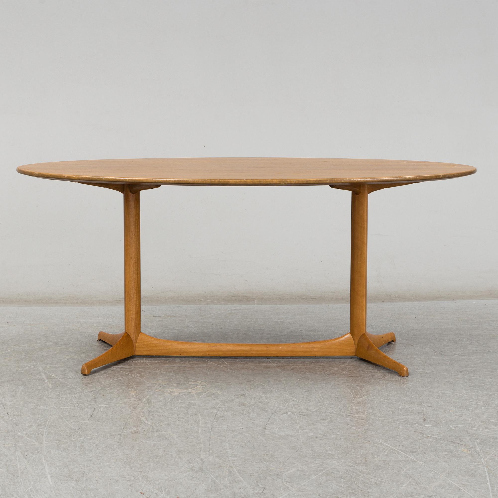 A 1959 'Plommonet' walnut coffee table by Kerstin Hörlin-Holmquist for Nordiska Kompaniet.