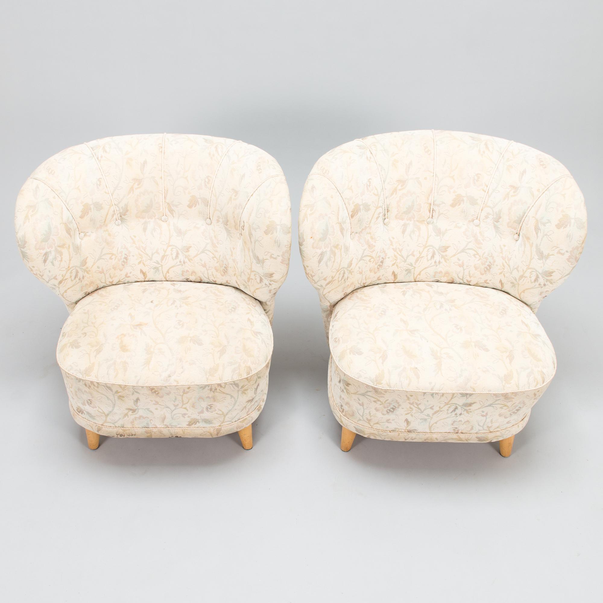 A pair of mid 20th century armchairs.
