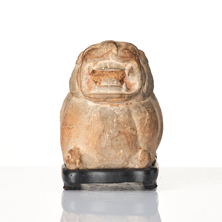 A pottery model of a recumant tiger/chimera, Han dynasty (206 BC-220 AD).