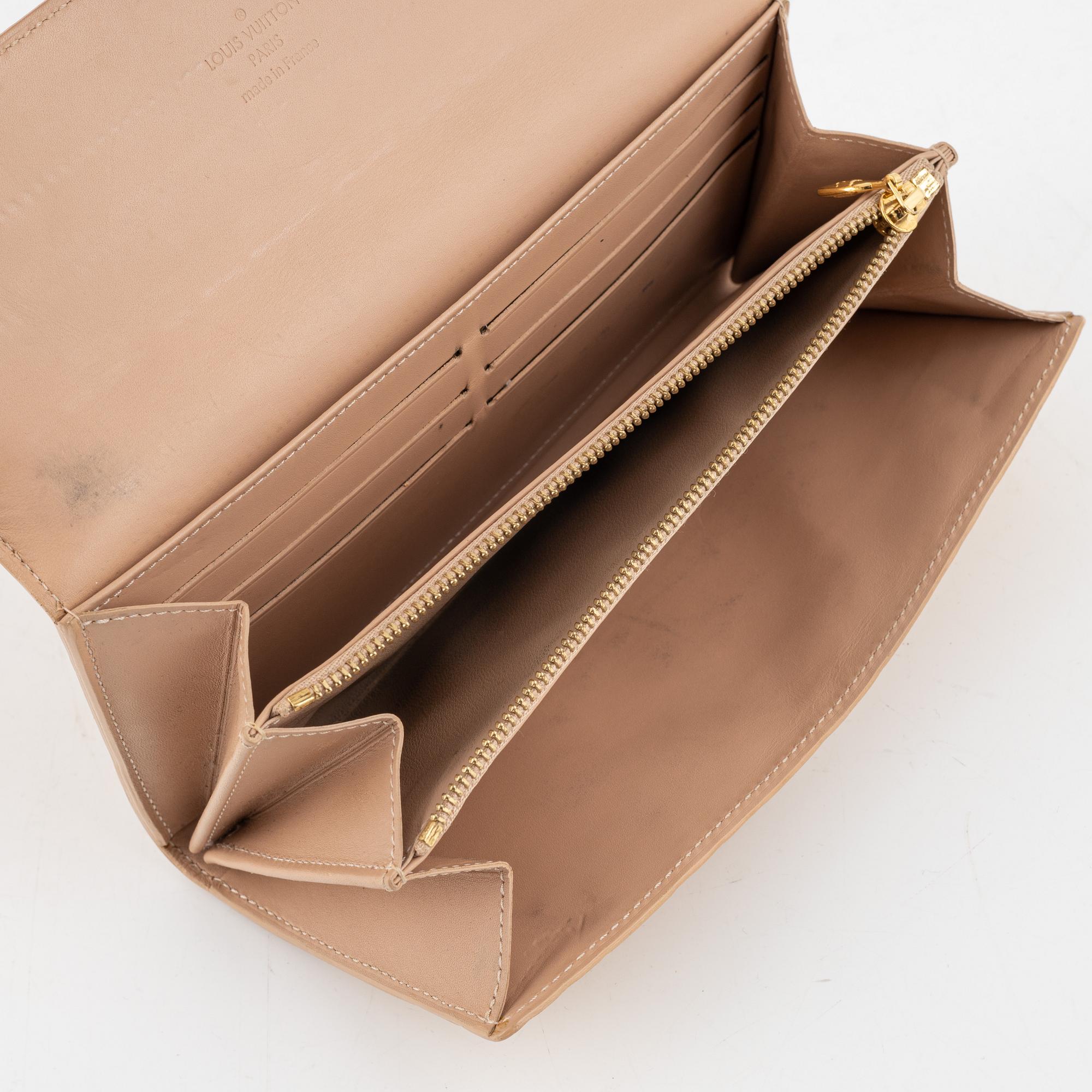 Louis Vuitton, a 'Sarah' vernis wallet.