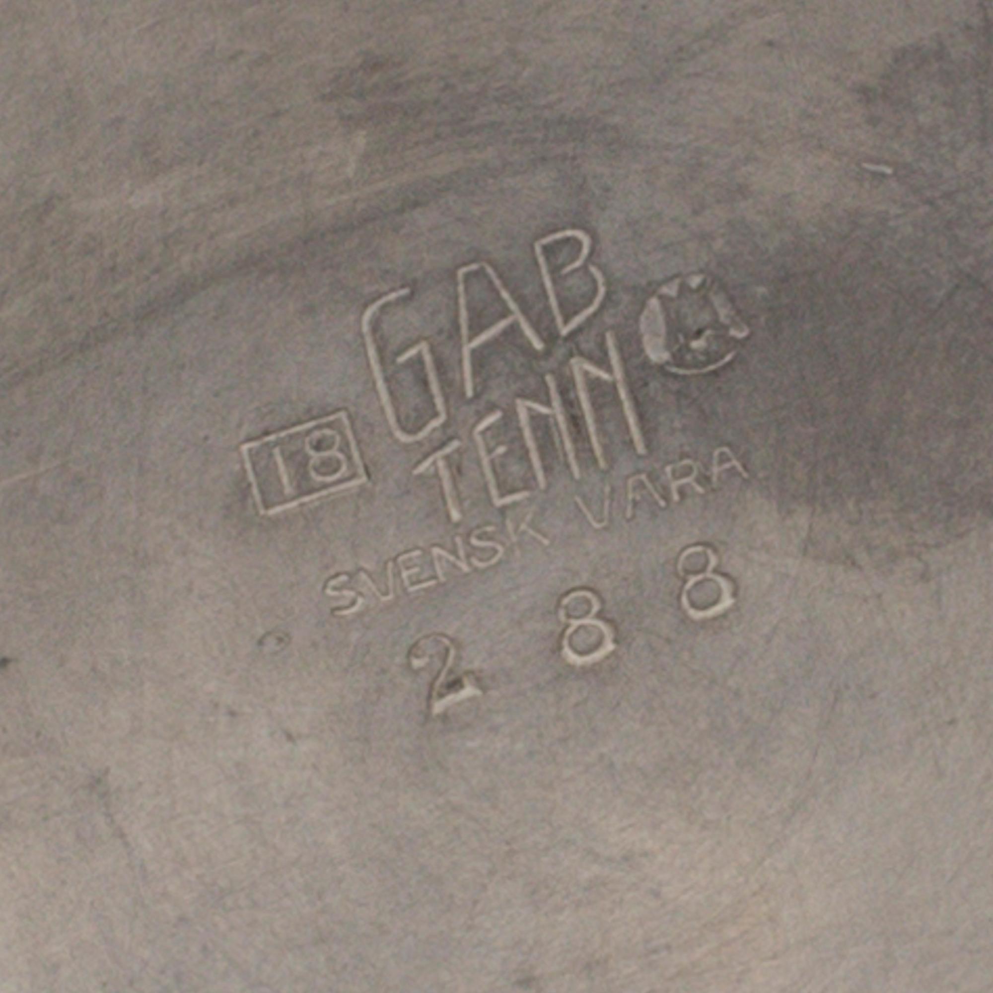 A tin winecooler by GAB, 1935.