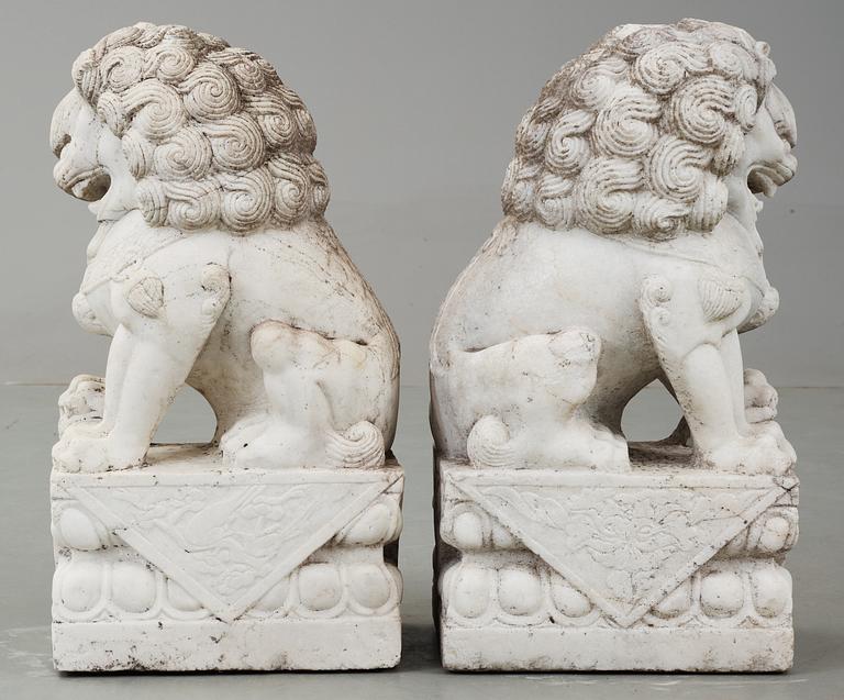 A pair of marble figures of 'Buddhist Lions', China.