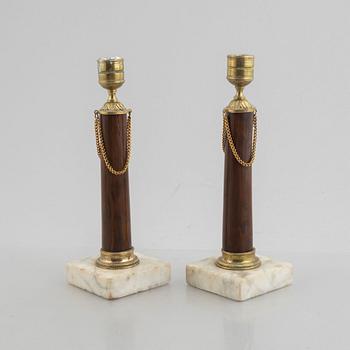 A pair of late Gustavian gilt brass, marble and birch candlesticks, circa 1800.