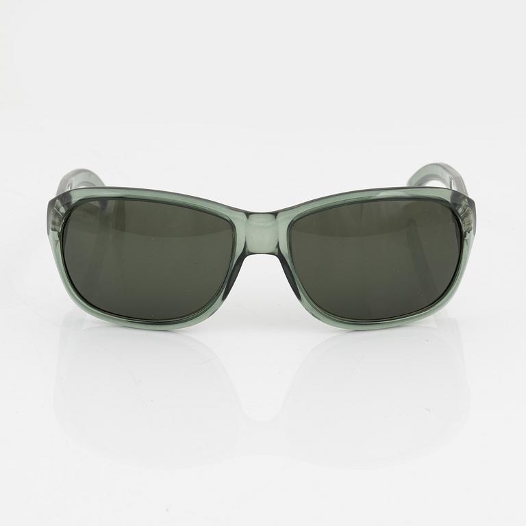 Gucci, a pair of green sunglasses.