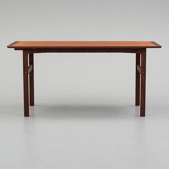 A second half of the 20th century teak vaneered coffee table.