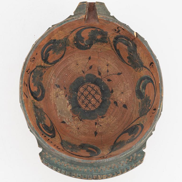 A lathed and painted bowl dated 1783.