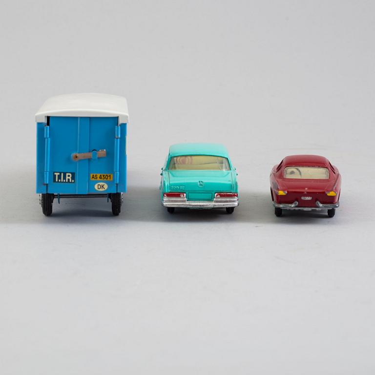 Three tin toy cars, Tekno Denmark, 1960s.