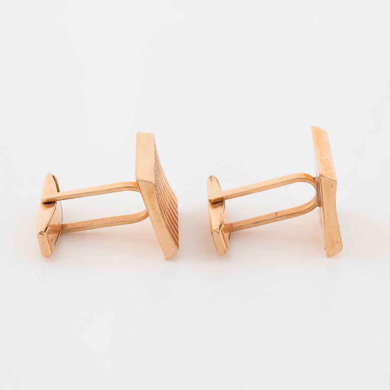 A pair of cuff links.