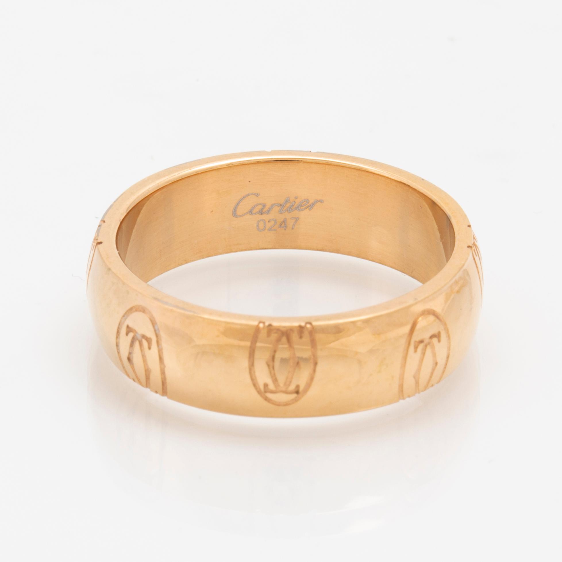 An 18K gold ring Logo de Cartier by Cartier. Bukowskis