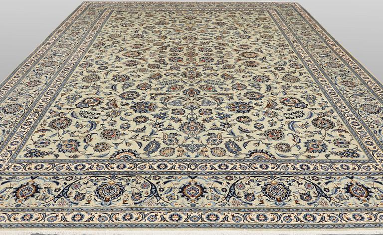 A Keshan carpet, signed, approx. 398 x 301 cm.
