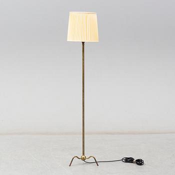 A 1940's brass floor lamp by Harald Elof Notini for Böhlmarks, Sweden 1940's, model 15390.