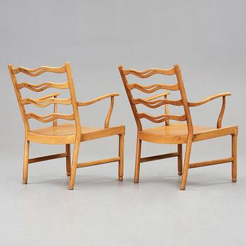 Ole Wanscher, a pair of walnut armchairs, model 1755 for Fritz Hansen, Denmark 1945.