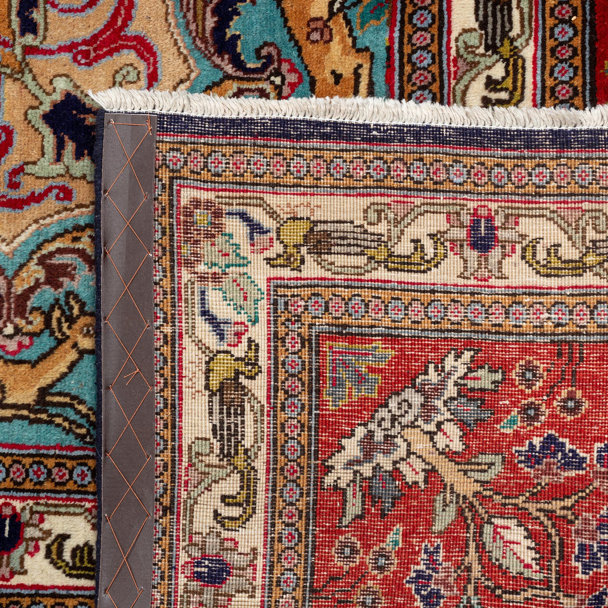 A carpet, Tabriz, signed Ipchilar, ca 385 x 280 cm.