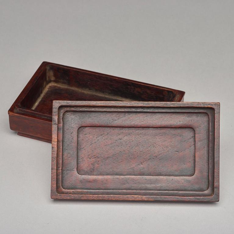 A Chinese wooden box, circa 1900.