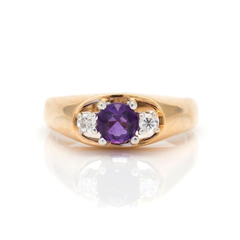 A ring with faceted amethyst and diamonds.