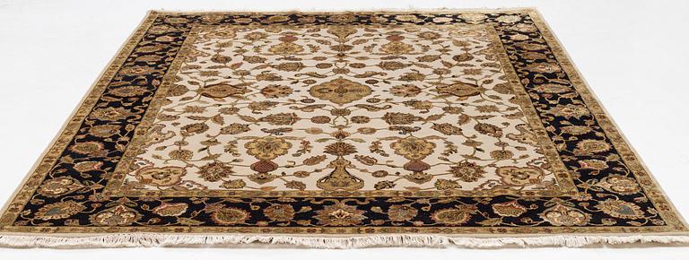 An oriental carpet, part silk, circa 311 x 242.