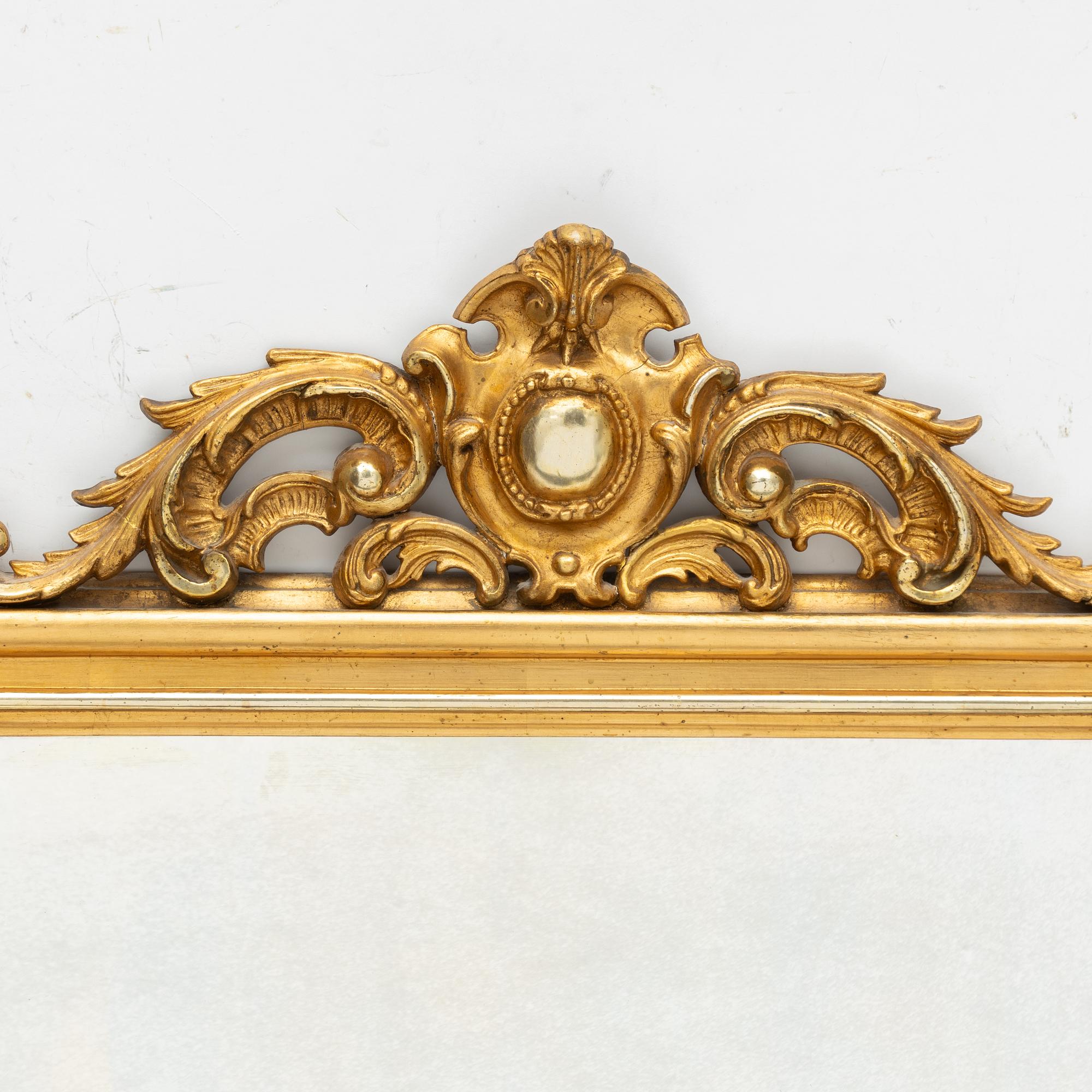 A rococo style mirror by AG Säfström Kristianstad from around the year 1900.