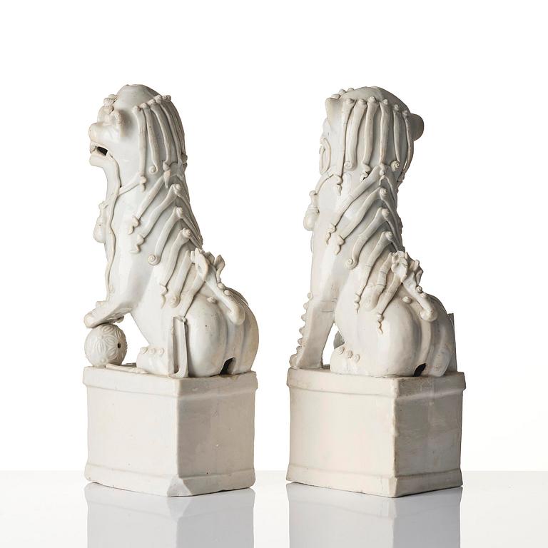 A pair of Chinese blanc de Chine 'Buddhist lion' joss stick holders, Qing dynasty, Kangxi (1662-1722).