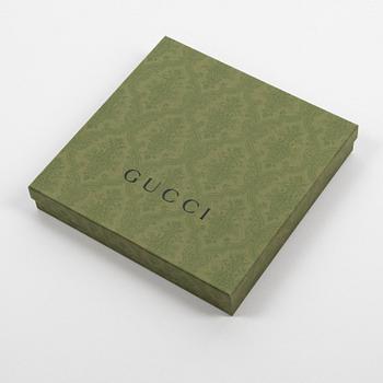 Gucci, a 'Flora' twill silk scarf.