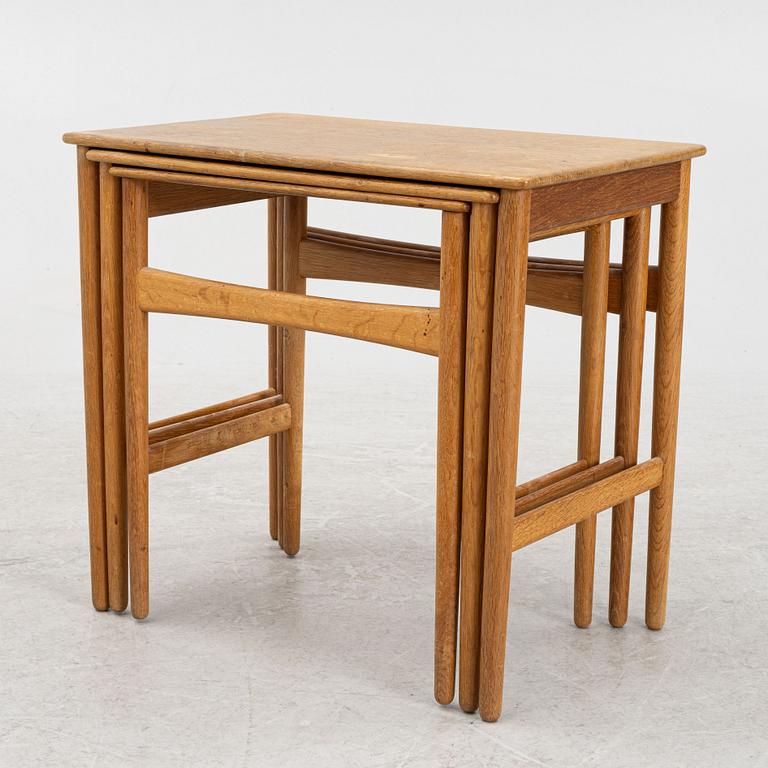 Hans J. Wegner, a nesting table, Andreas Tuck, Denmark, mid 20th Century.