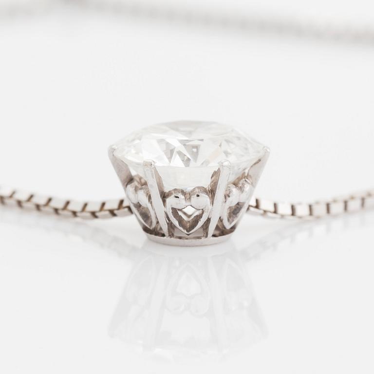 An 18K white gold pendant set with a round brilliant-cut diamond weight ca 3.50 cts quality ca H si.