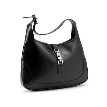 638. GUCCI, a black leather shoulder bag, "Jackie".