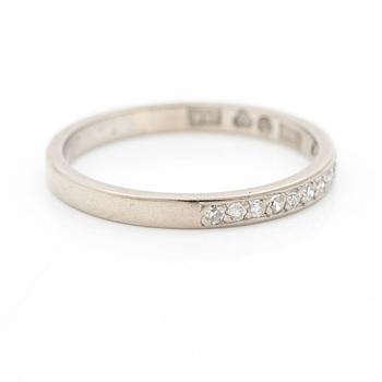 18K white gold half eternity ring with octagonal-cut diamonds.