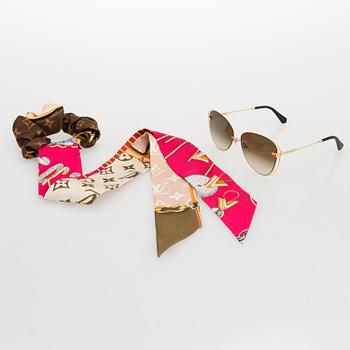 Louis Vuitton, 'À Nous Deux' sunglasses and a Chouchou scrunchie.